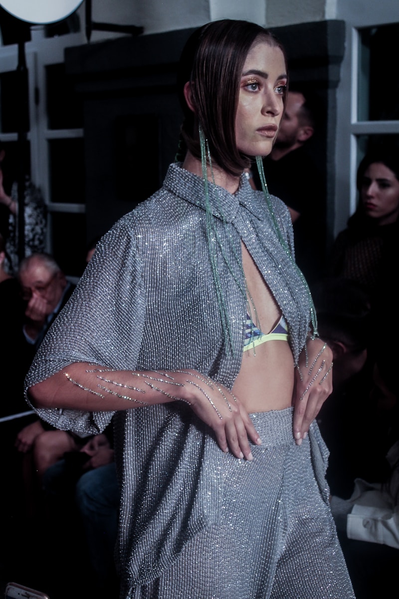 woman in gray and white polka dot dress